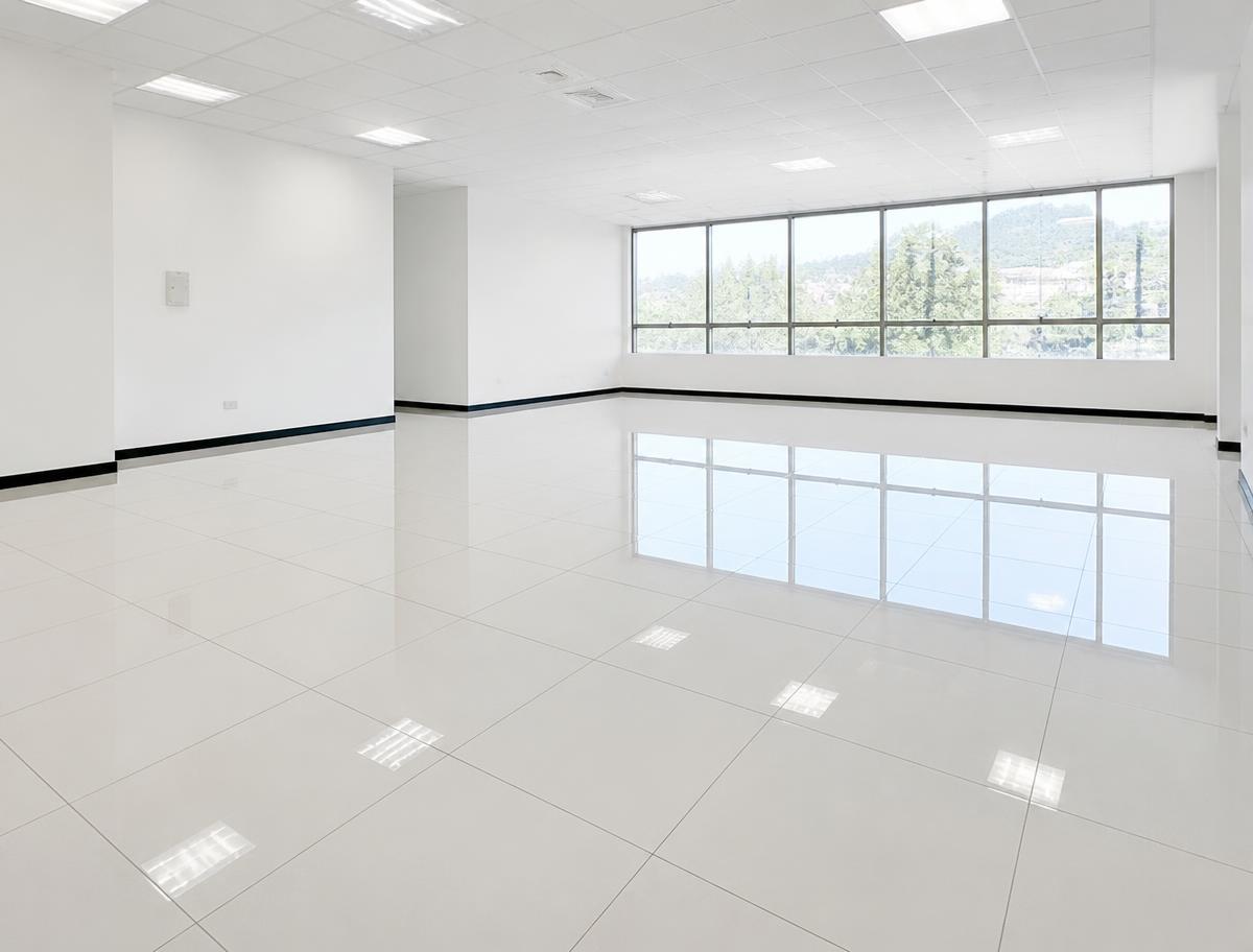 Freshly cleaned commercial room with a glossy reflective tile floor